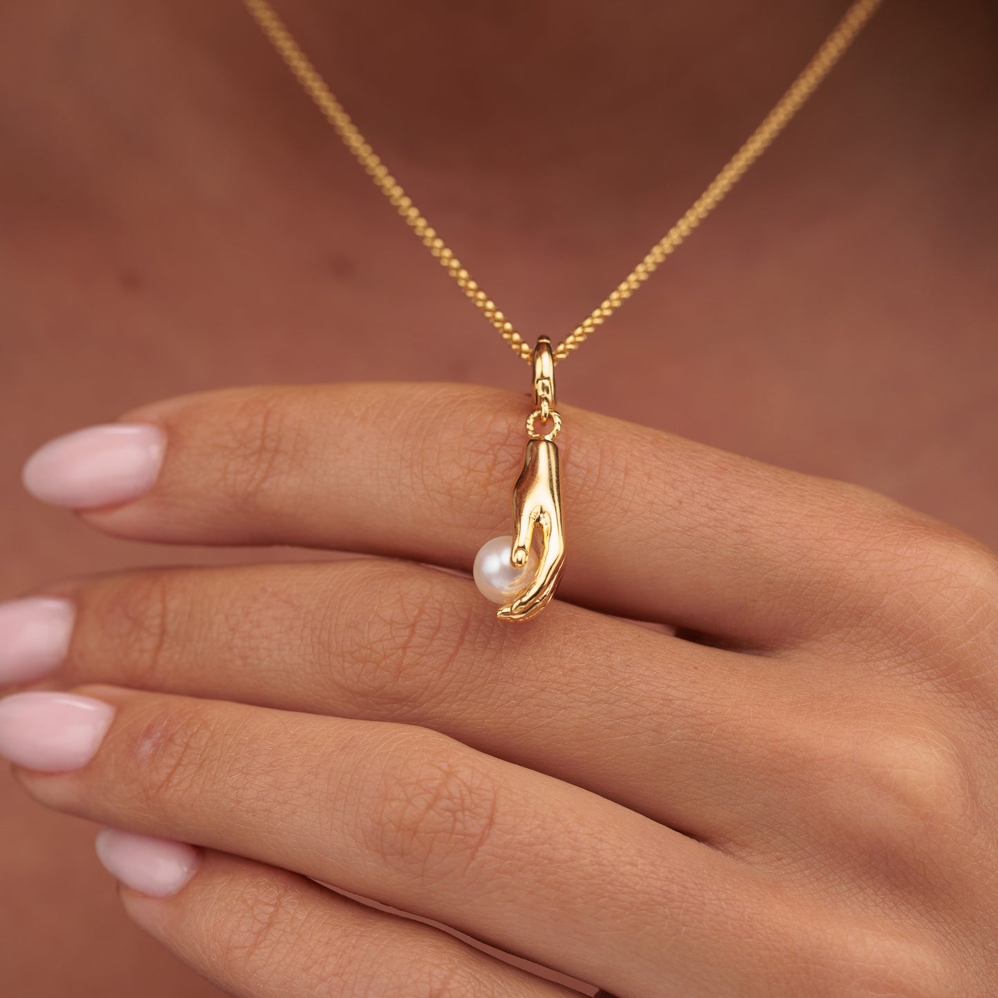 Gold Plated Hand and Pearl Charm