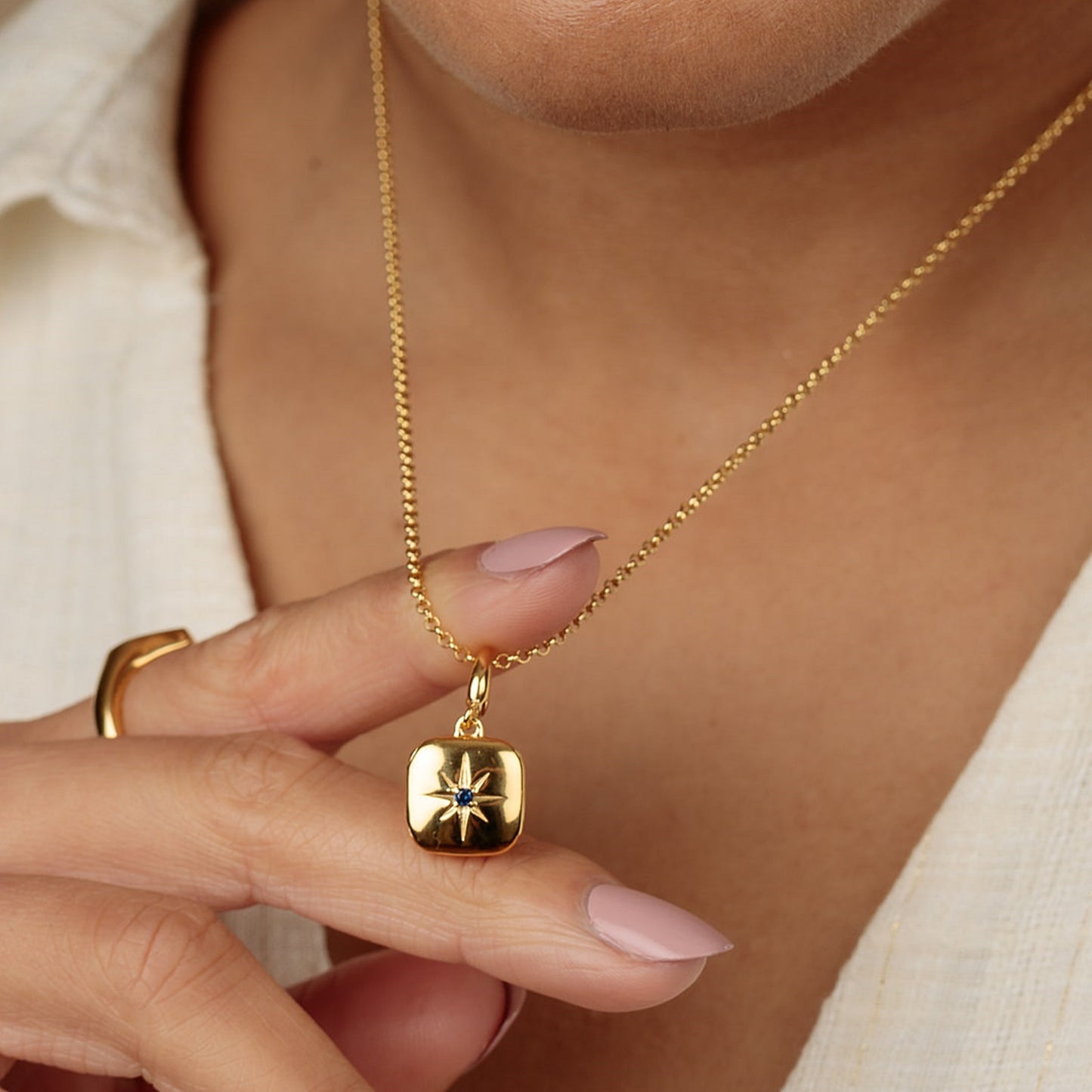 Gold Star Locket Charm with Blue Stone