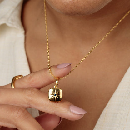 Gold Star Locket Charm with Blue Stone